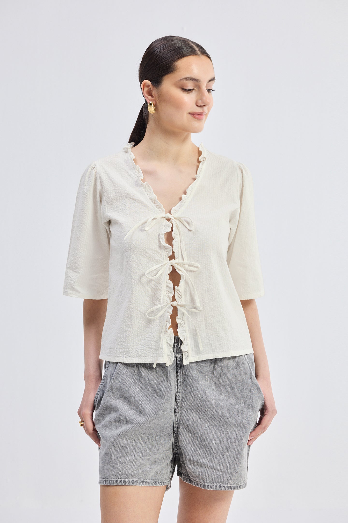 Relaxed Fit Top With Ruffles and Front-Ties in Cream
