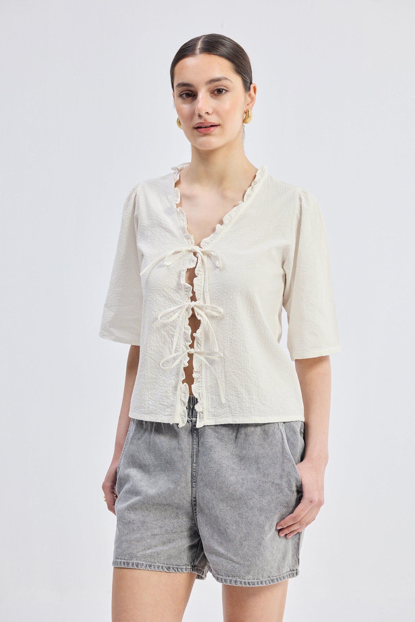 Relaxed Fit Top With Ruffles and Front-Ties in Cream